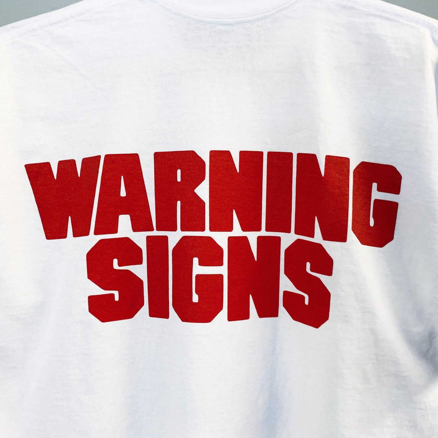 WARNING SIGNS NEGATIVE T-SHIRT by MENACE